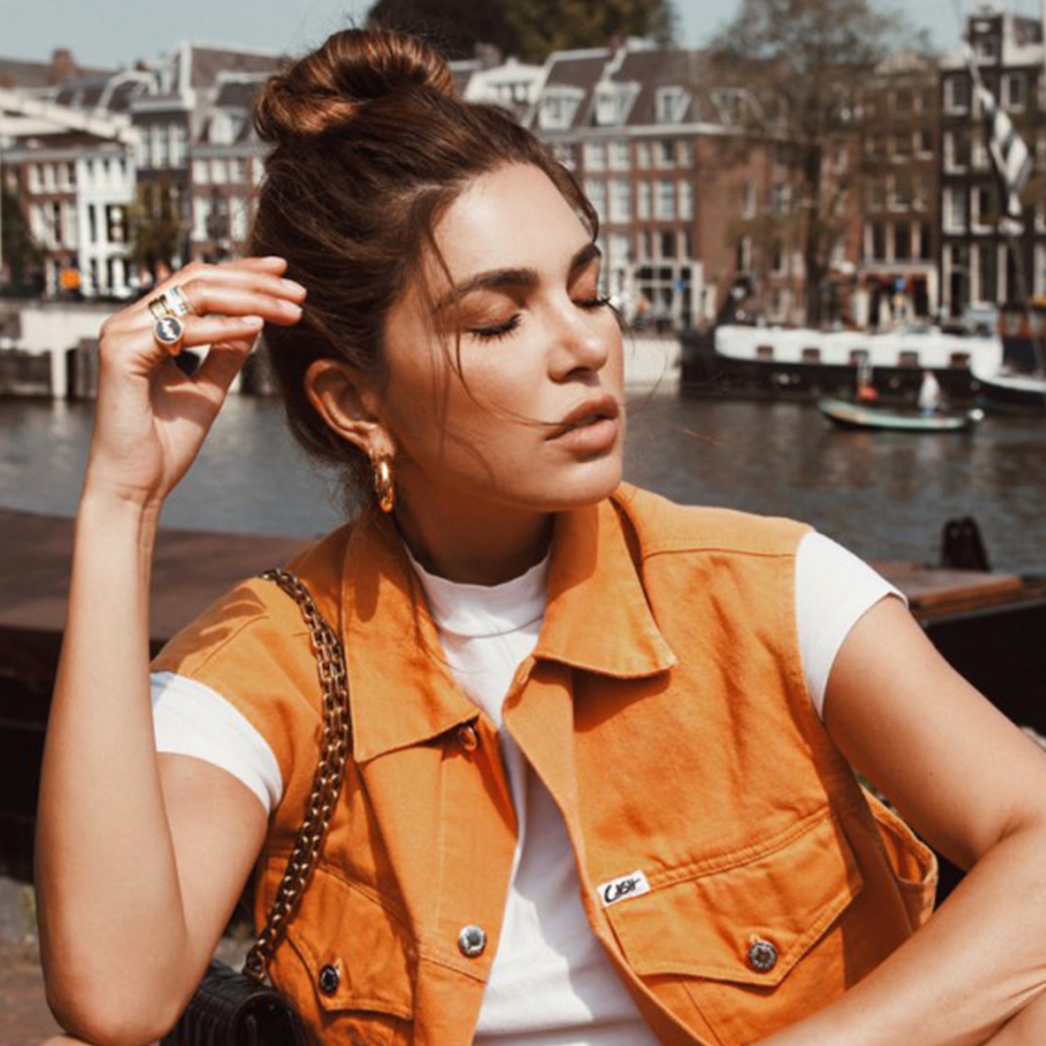 Negin Mirsalehi shown in the 3cm Tube Hoops in Yellow Gold