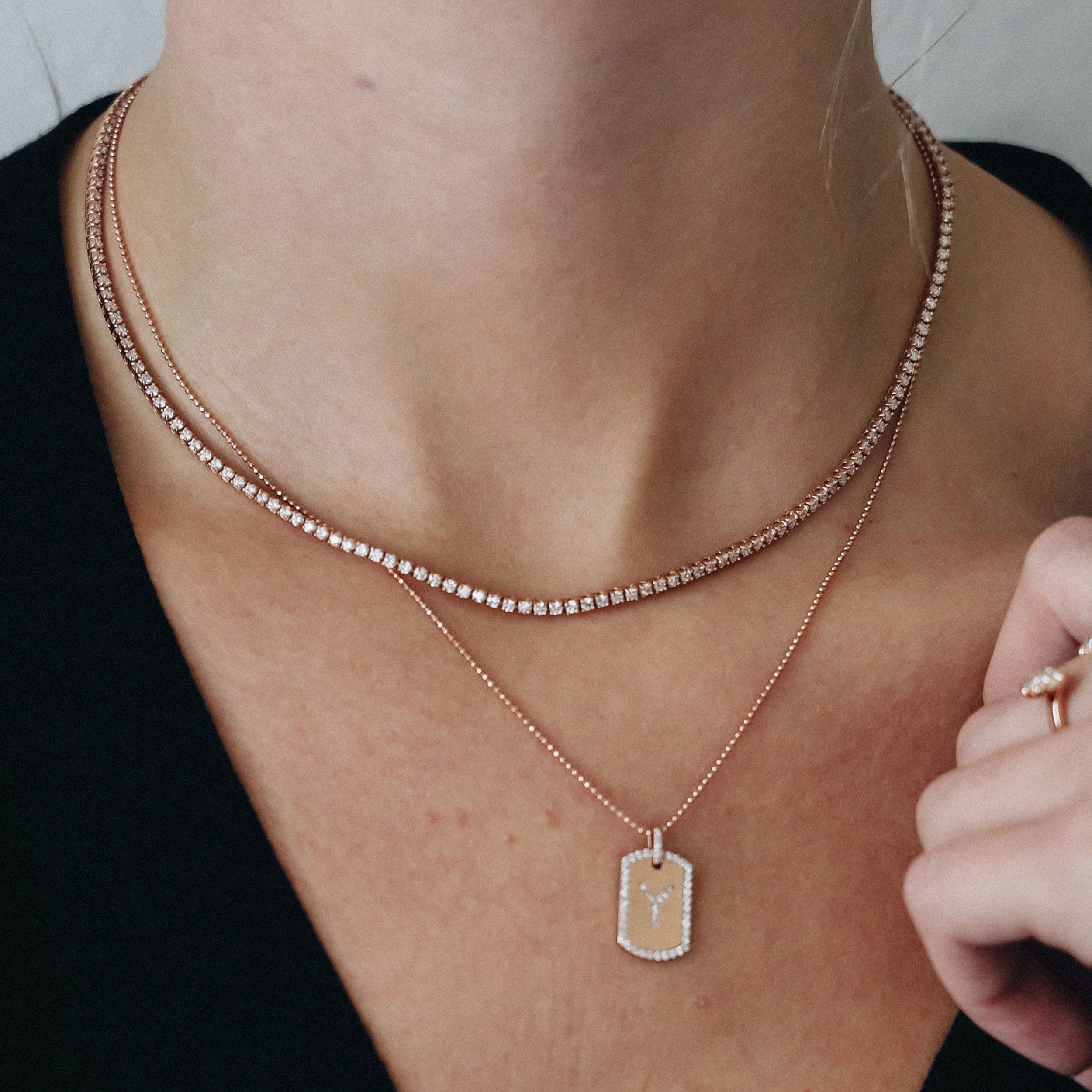 5.25 Carat Tennis Necklace shown alongside the Initial Dogtag in rose gold.