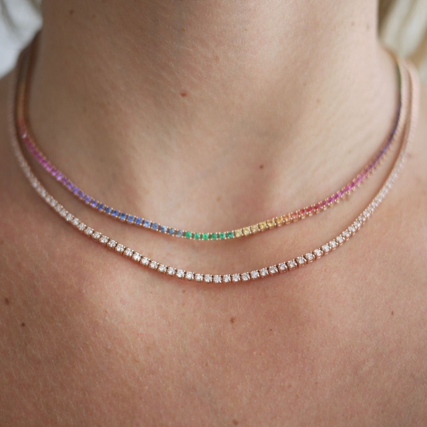 5.25 Carat Tennis Necklace shown below the Rainbow Tennis Necklace in rose gold.