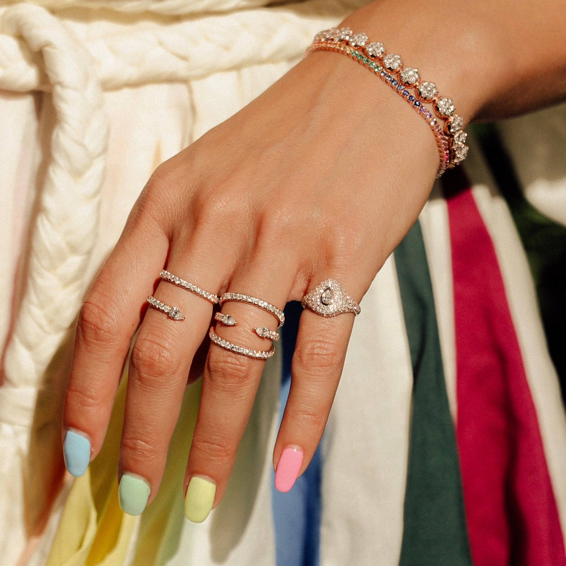 The Pear Bling Ring shown with the Alpha Ring and Serpent Ring.