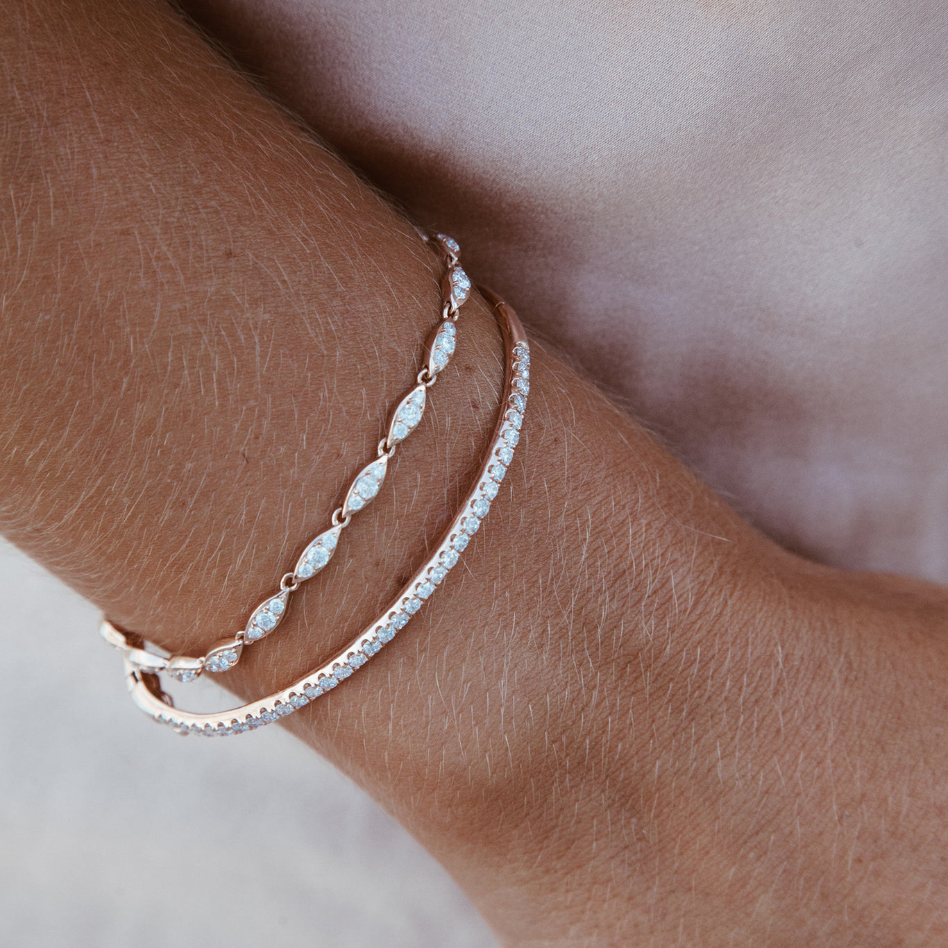 The Classic Diamond Bangle shown paired with the Angel Bracelet. 