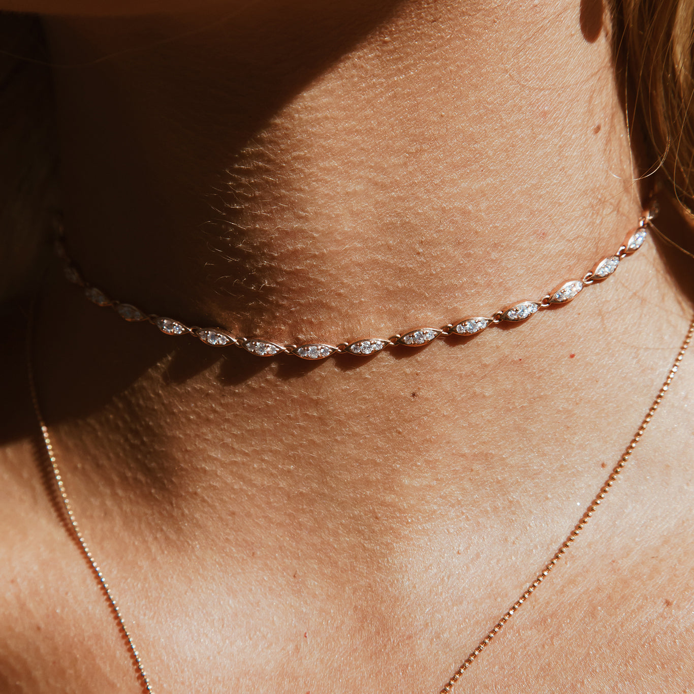 The Angel Choker shown in rose gold.