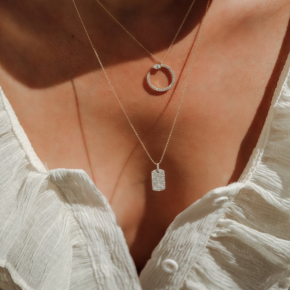 The Diamond Dogtag shown beautifully layered with our Serpent Necklace.