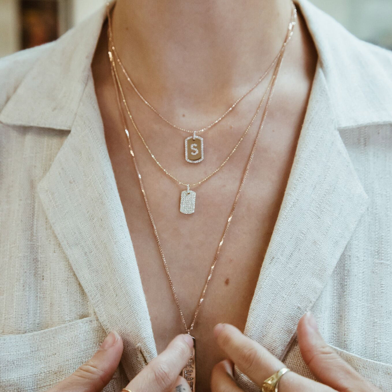 The Initial Dogtag shown beautifully layered with the Diamond Dogtag and Longtag Necklace. A must have look!