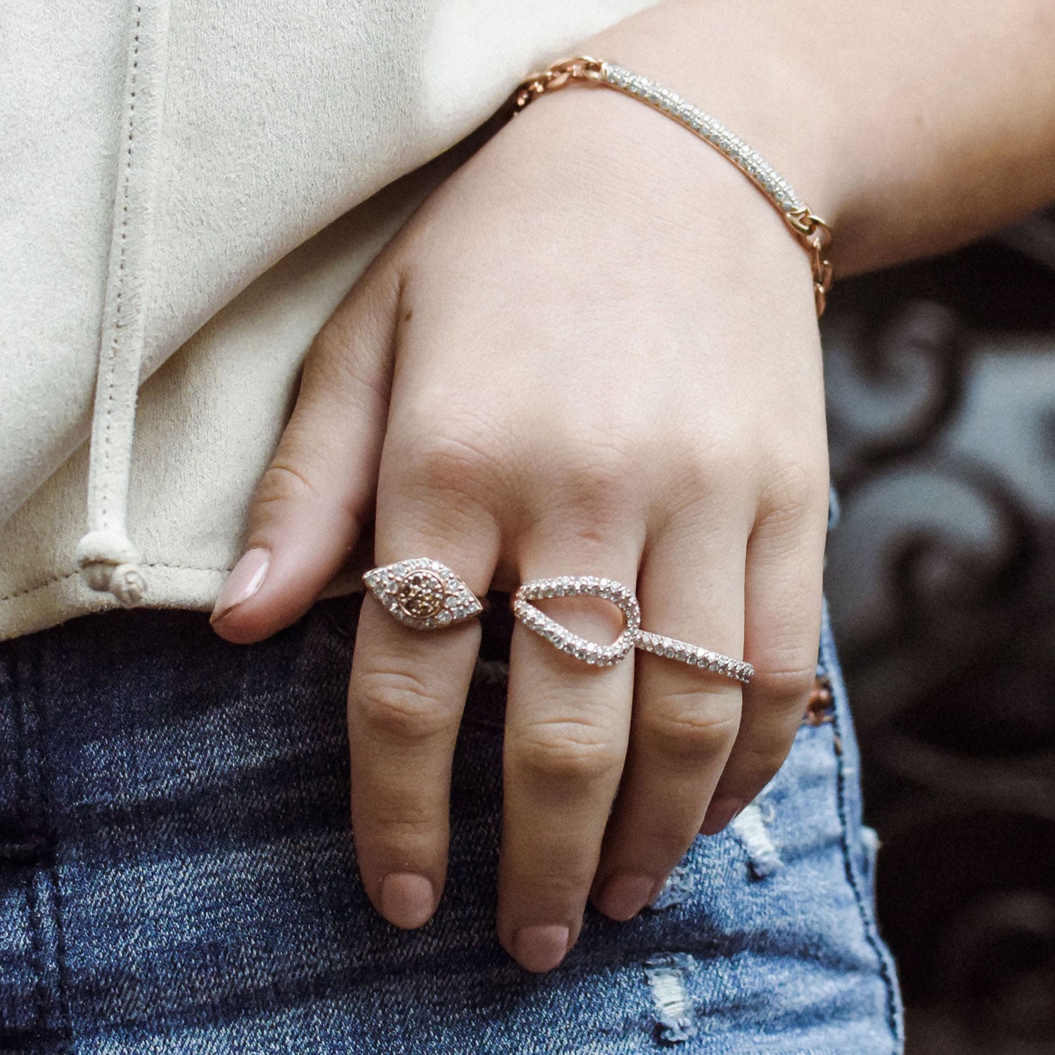 The Drishti Ring is shown paired with the beautiful double finger Athena Ring and Pantheon Bracelet.