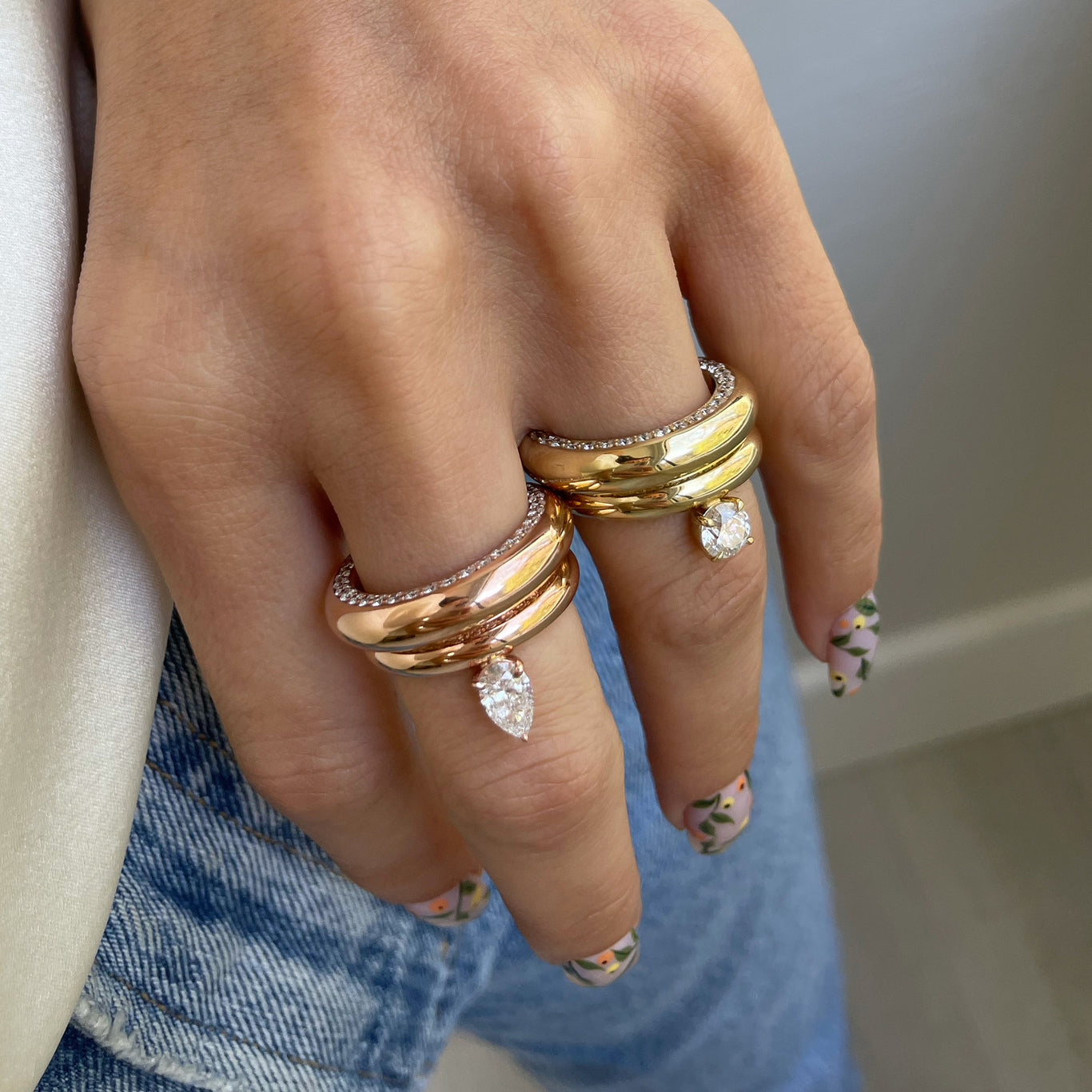 Floating Pear Ring shown layered with the Bombe Ring