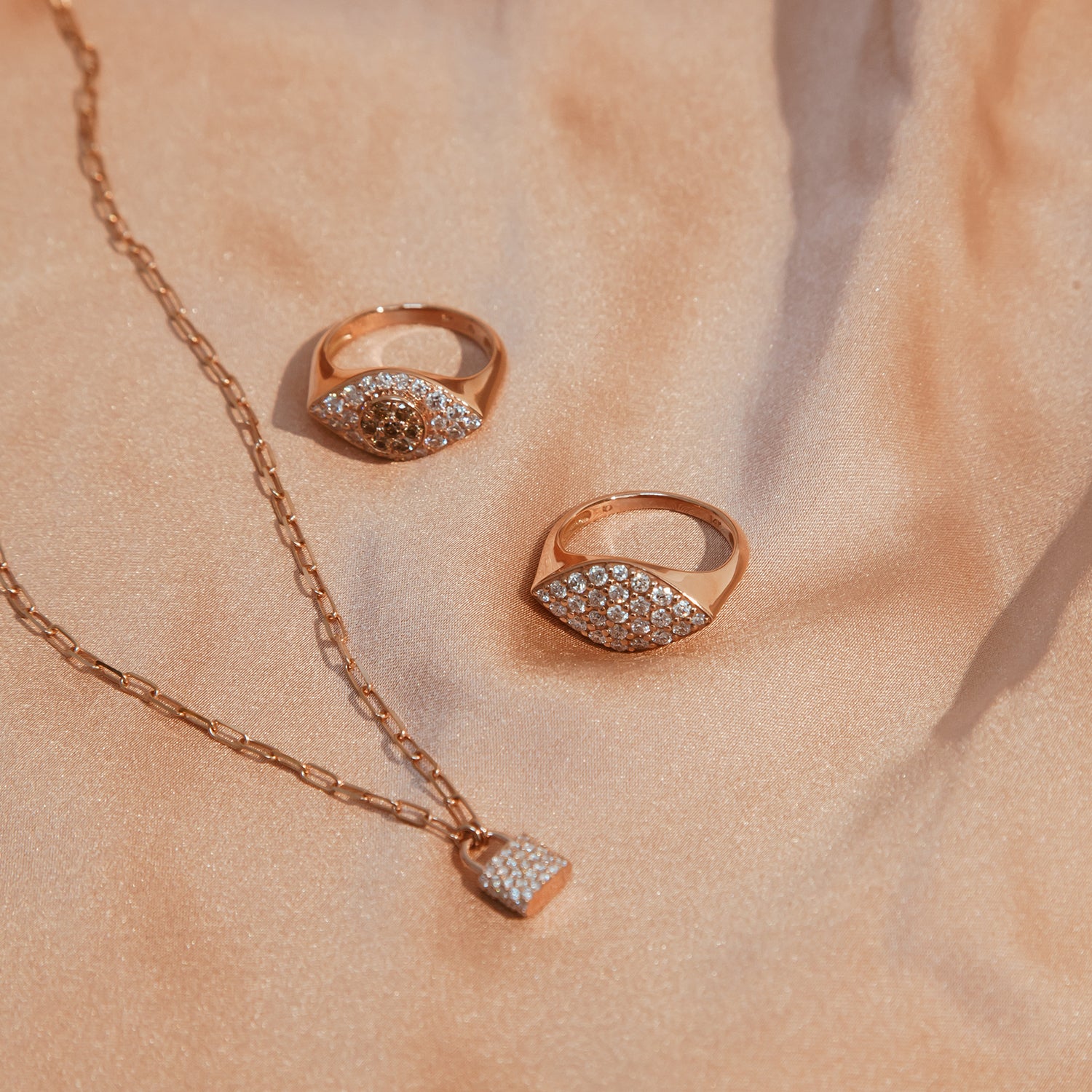 The Padlock Necklace shown with the Gemma Ring and Drishti Ring.