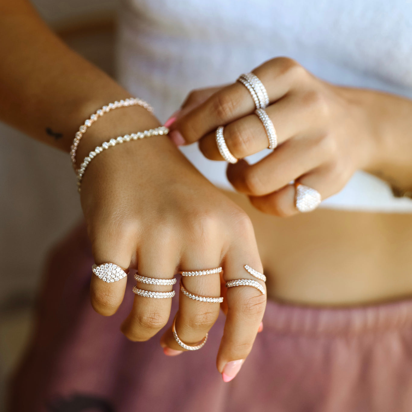 Our Ditto Ring shown with the Gemma Pinky Ring, Arabesque Ring, and Viper Ring.