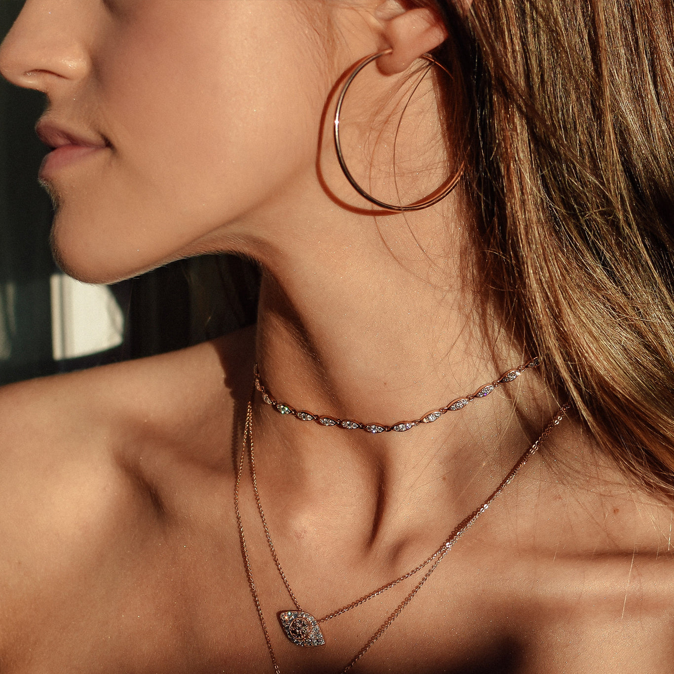 The 5cm Skinny Hoops shown with the Angel Choker and Drishti Necklace.