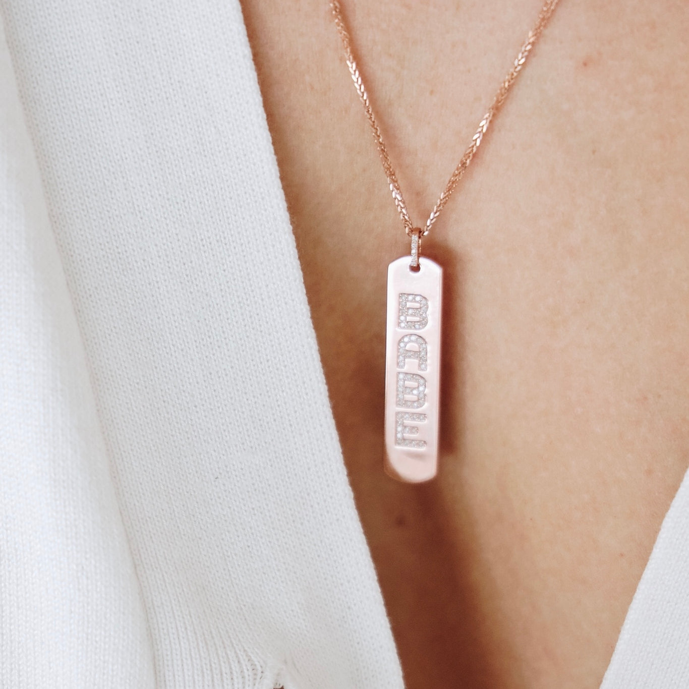 Longtag Necklace shown engraved with "Babe".