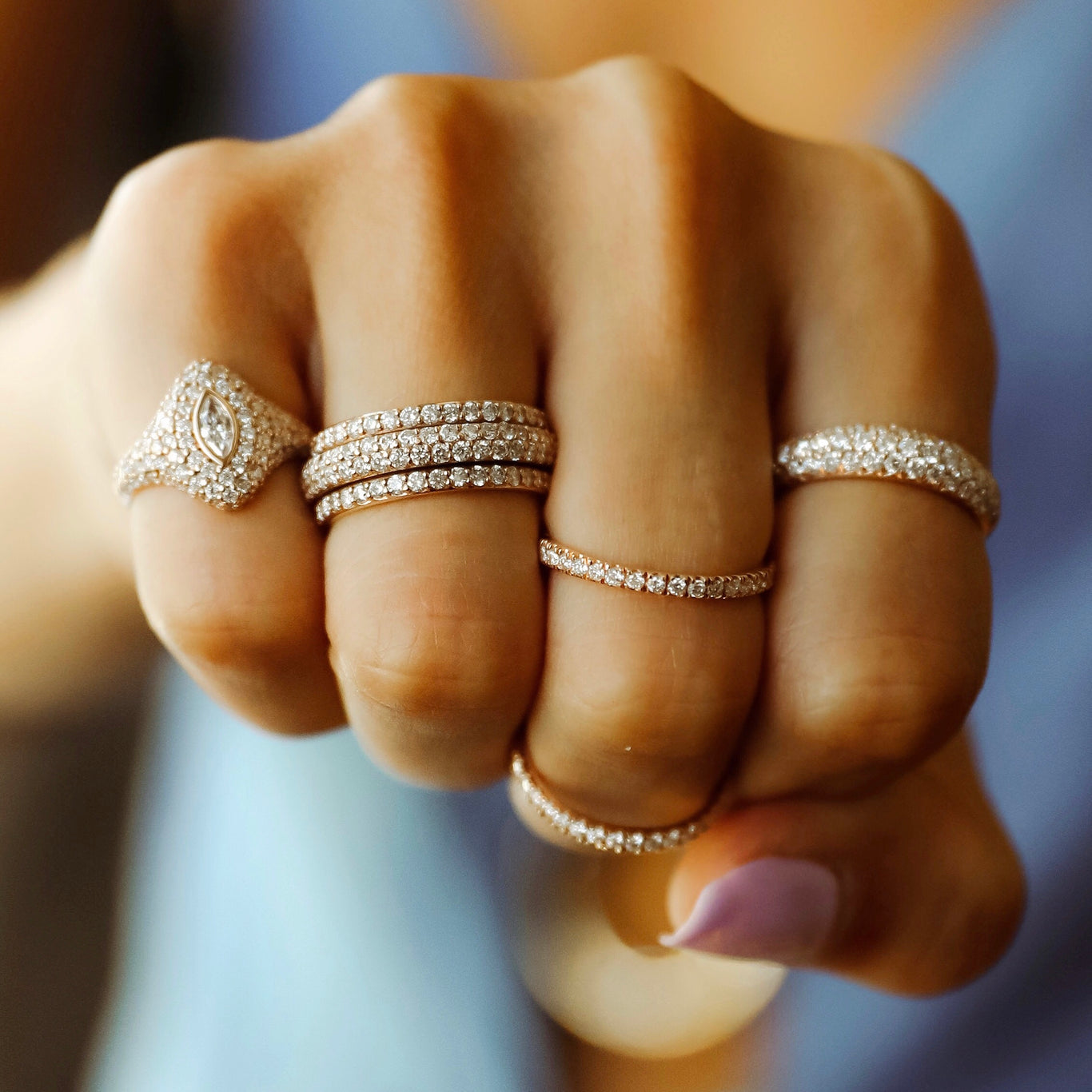 Diamond Orbit Ring shown on the ring finger next to the Marquis Pinky Ring and Olympia Ring.
