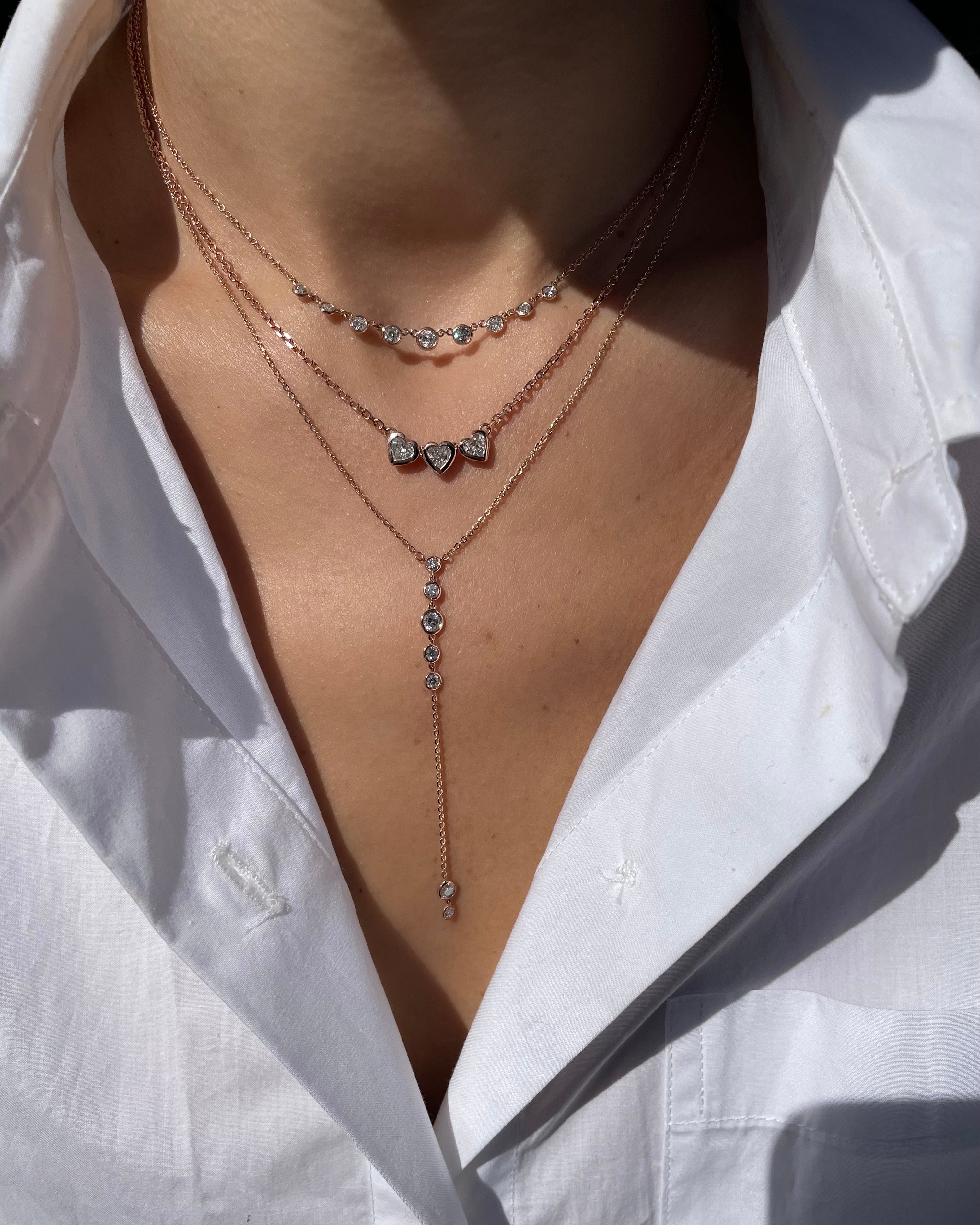 Bezel Lariat Necklace shown with the Bezel 3 Hearts Necklace and Bezel Mini Starstruck Necklace