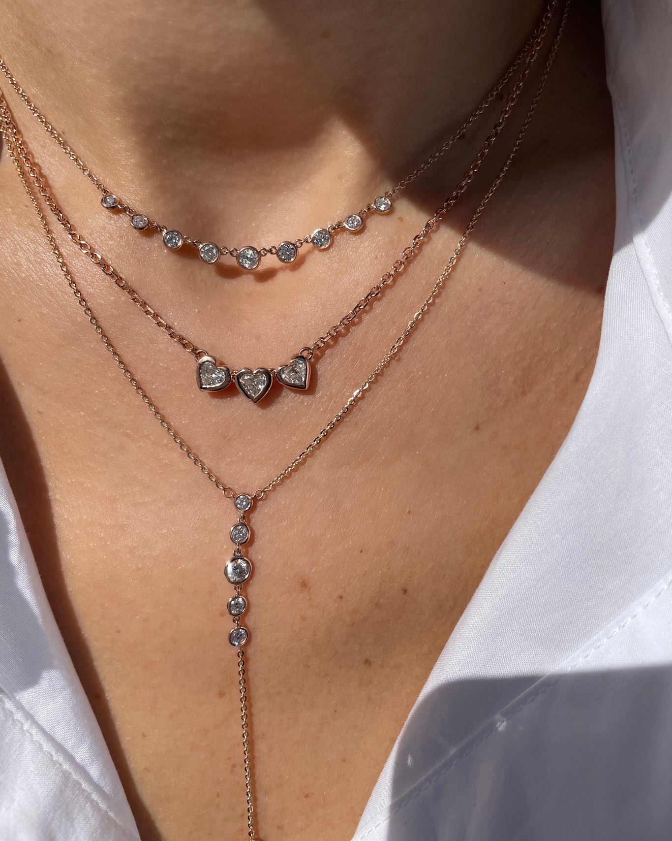 Bezel Lariat Necklace shown with the 3 Hearts Necklace and Bezel Mini Starstruck Necklace