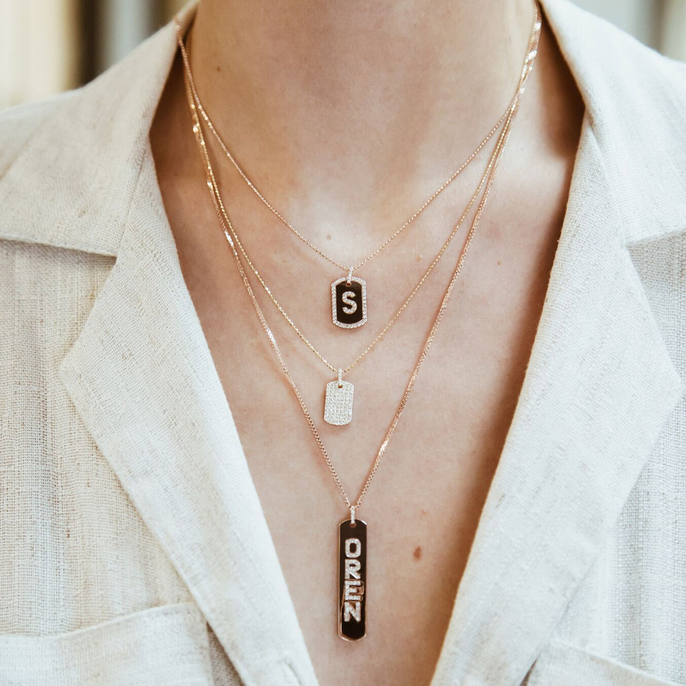 Longtag Necklace shown layered with the Initial Diamond Dogtag and the Diamond Dogtag.