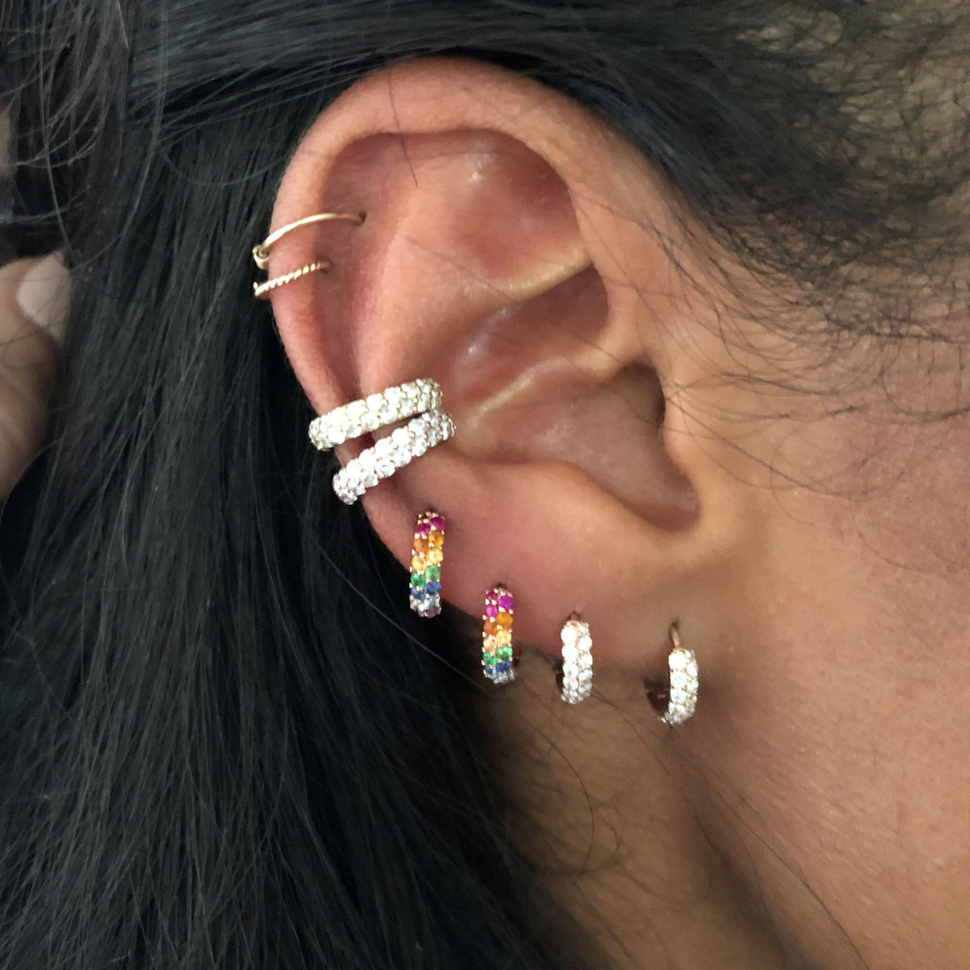 Two of the Boom Cuffs shown stacked along the ear with our Boom Huggies and Rainbow Boom Huggies.