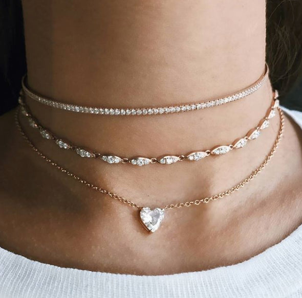 The Floating Heart Necklace shown with the Angel Choker and Infinity Choker. 