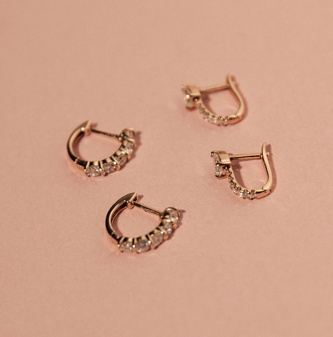 The Sparkler Huggies and Serpent Huggies shown in rose gold. The perfect stackable earrings!