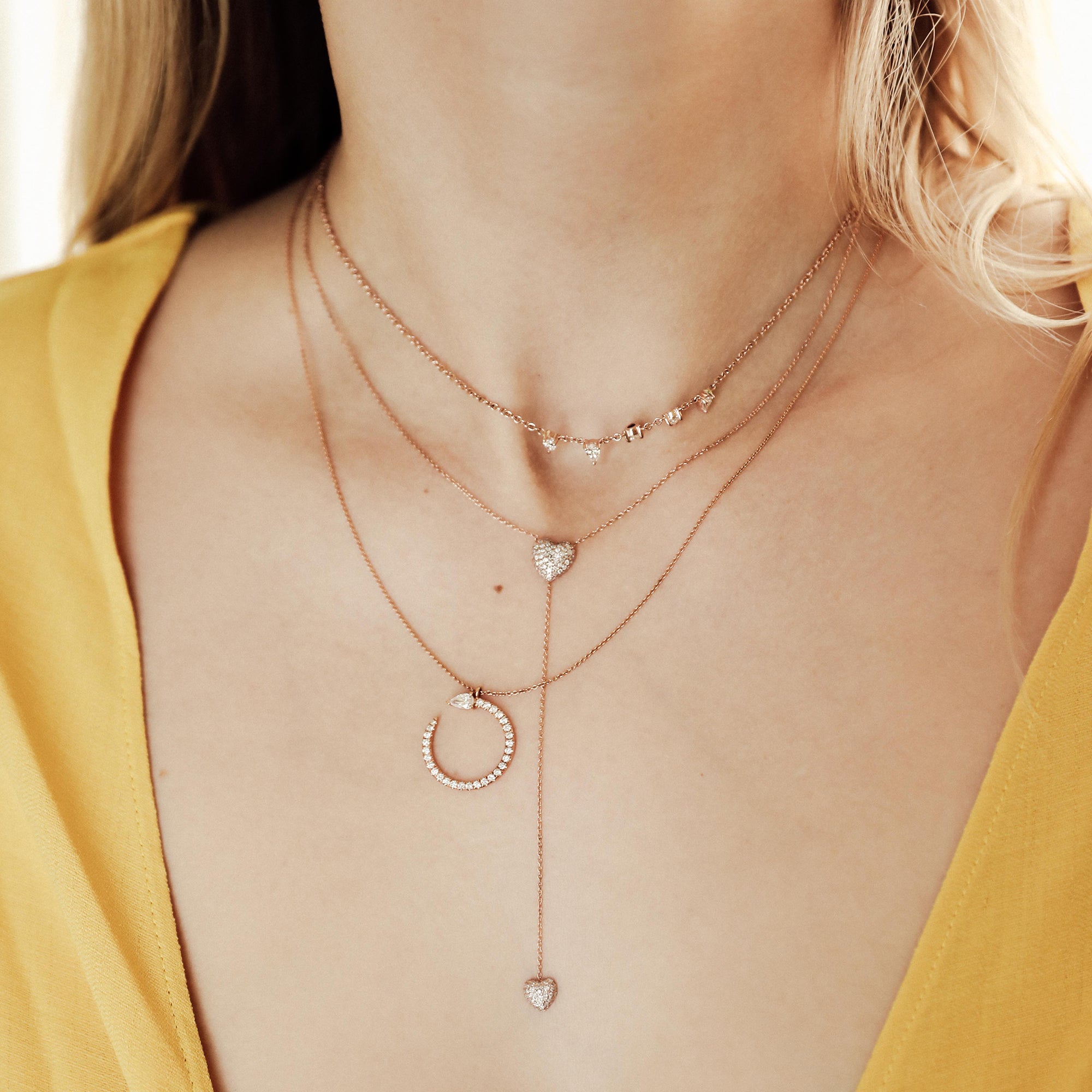 The Sweetheart Lariat in rose gold shown with the Serpent Necklace