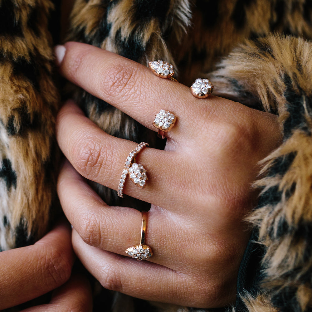 The Swing Ring shown with the Throne Ring and Elixir Mini Ring in rose gold.