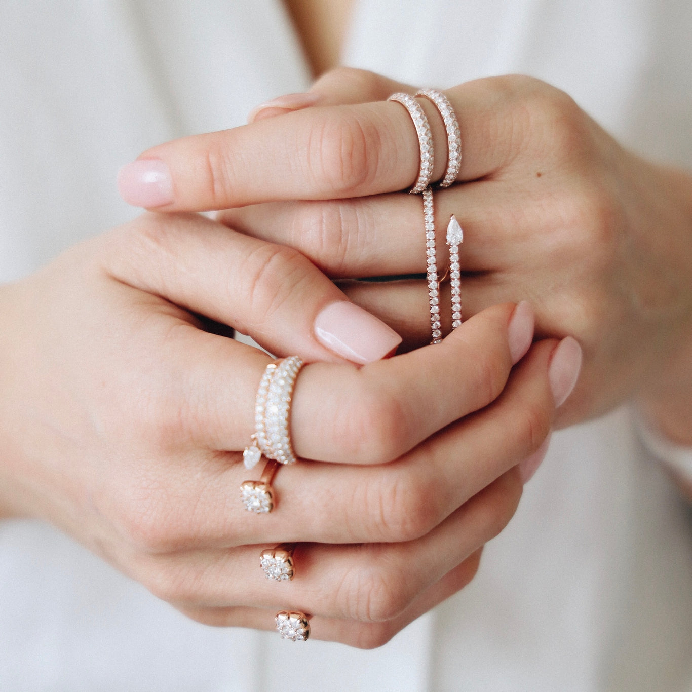 The Ditto Ring shown in rose gold styled on the index finger.