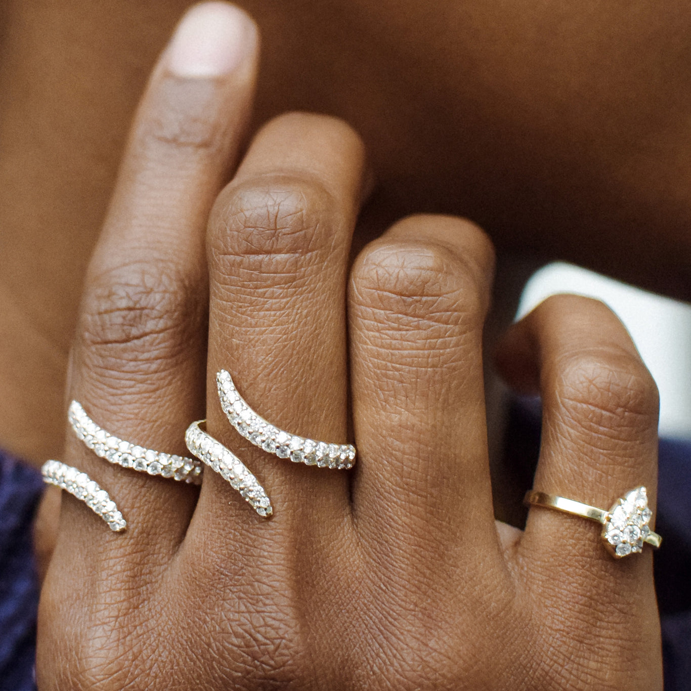 Two Viper Rings shown stacked with a Mini Elixir Ring on the pinky.