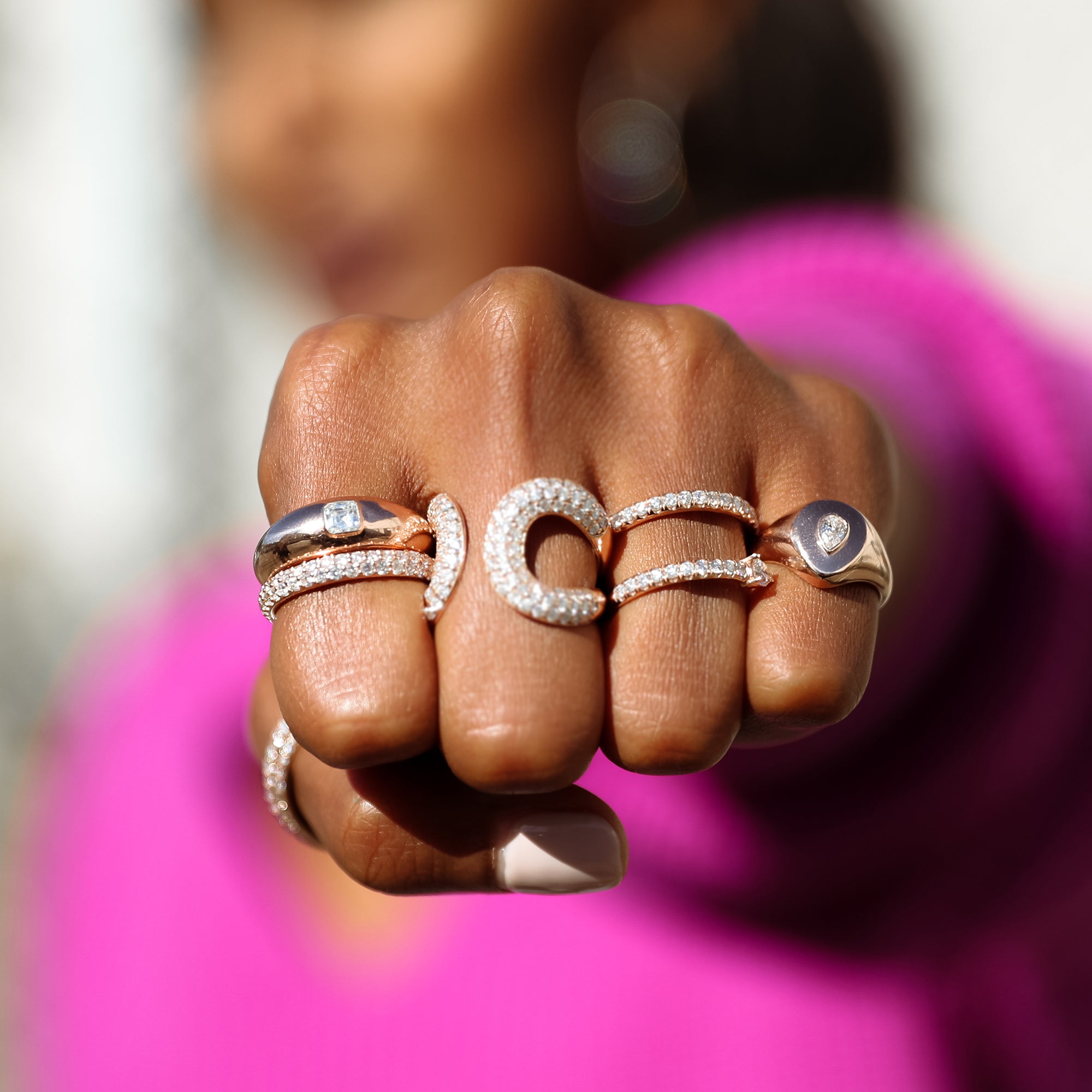 The Pear Pinky Ring shown modeled with the Serpent Ring, Medusa Ring, Asscher Dome Band, and Infinity Thumb Ring.