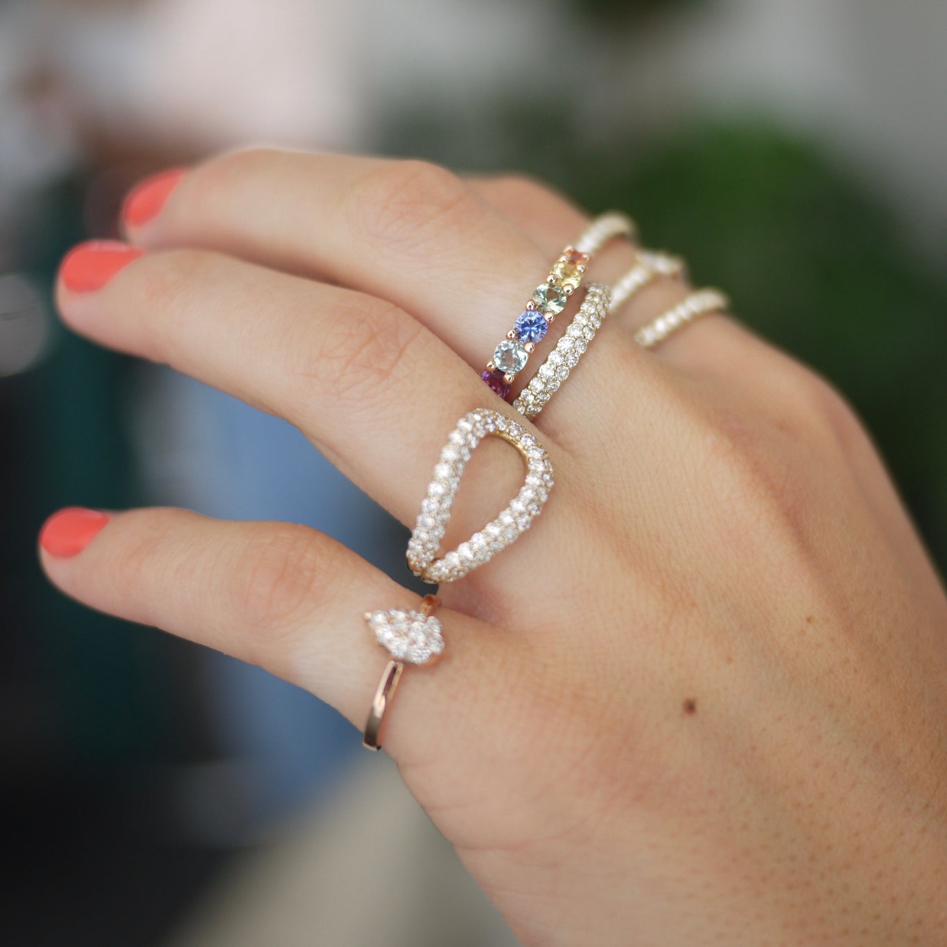 Athena Ring shown layered underneath the Rainbow Eternity Band. Also worn with the Alpha Ring and Mini Elixir Rings.