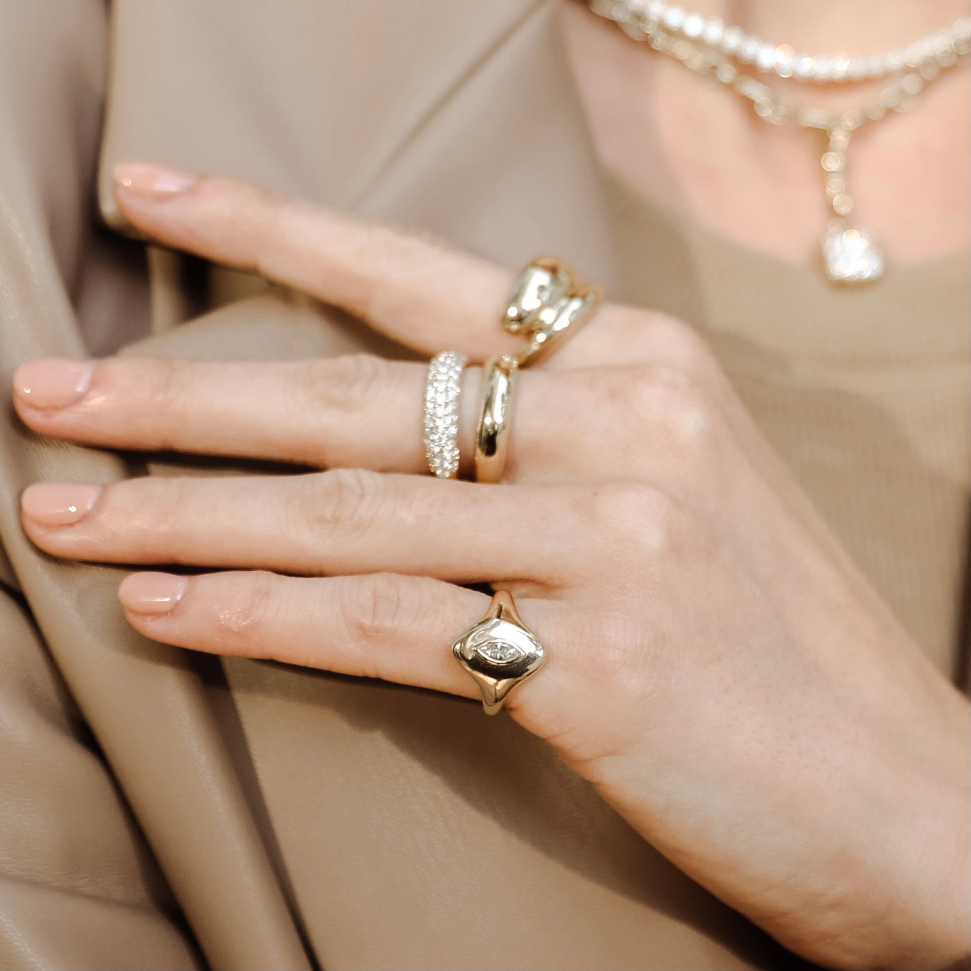 Marquise Pinky Ring in Yellow Gold shown with the Gemini Ring and Dome Wrap Ring