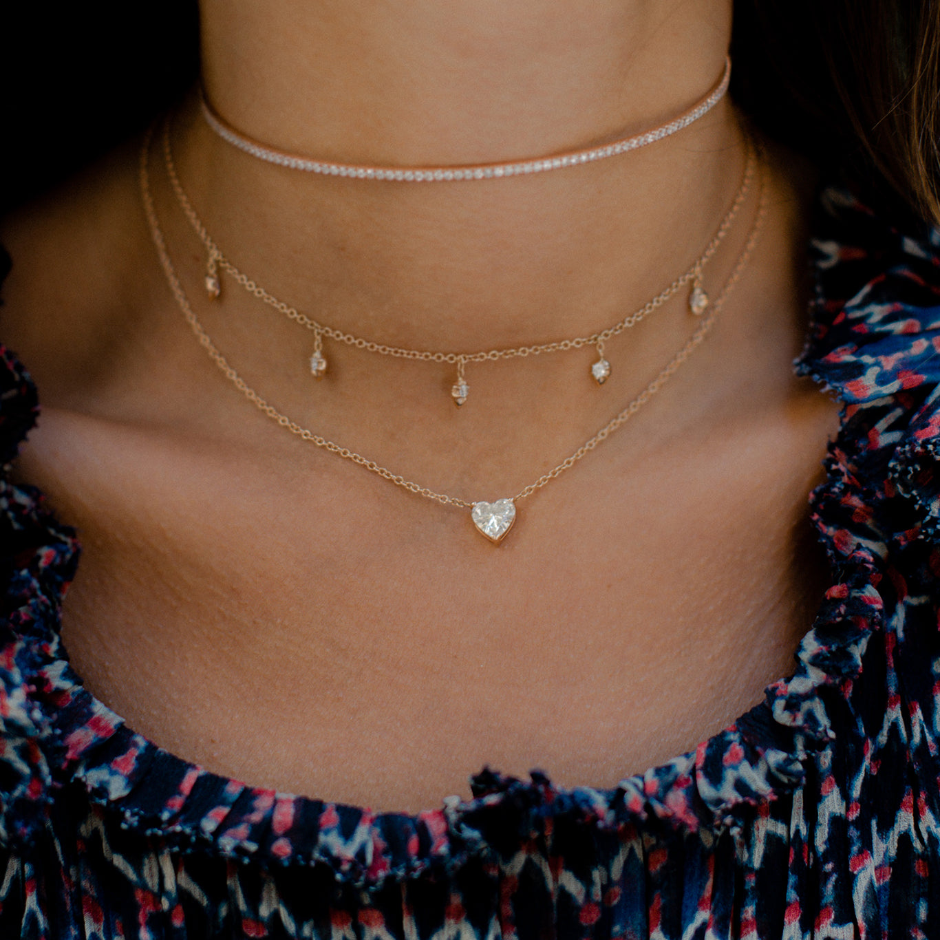 Our Floating Heart Necklace shown layered with our Lily Choker and Infinity Choker.