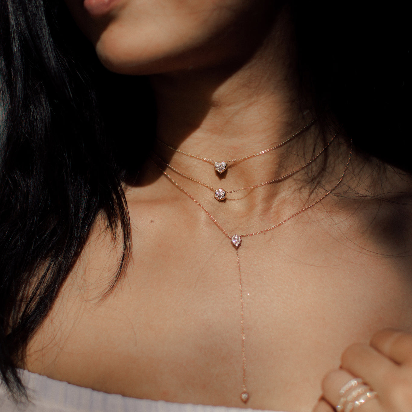 The Heart Choker Chain shown beautifully layered with the Bullet Choker Chain and Stella Lariat Necklace.