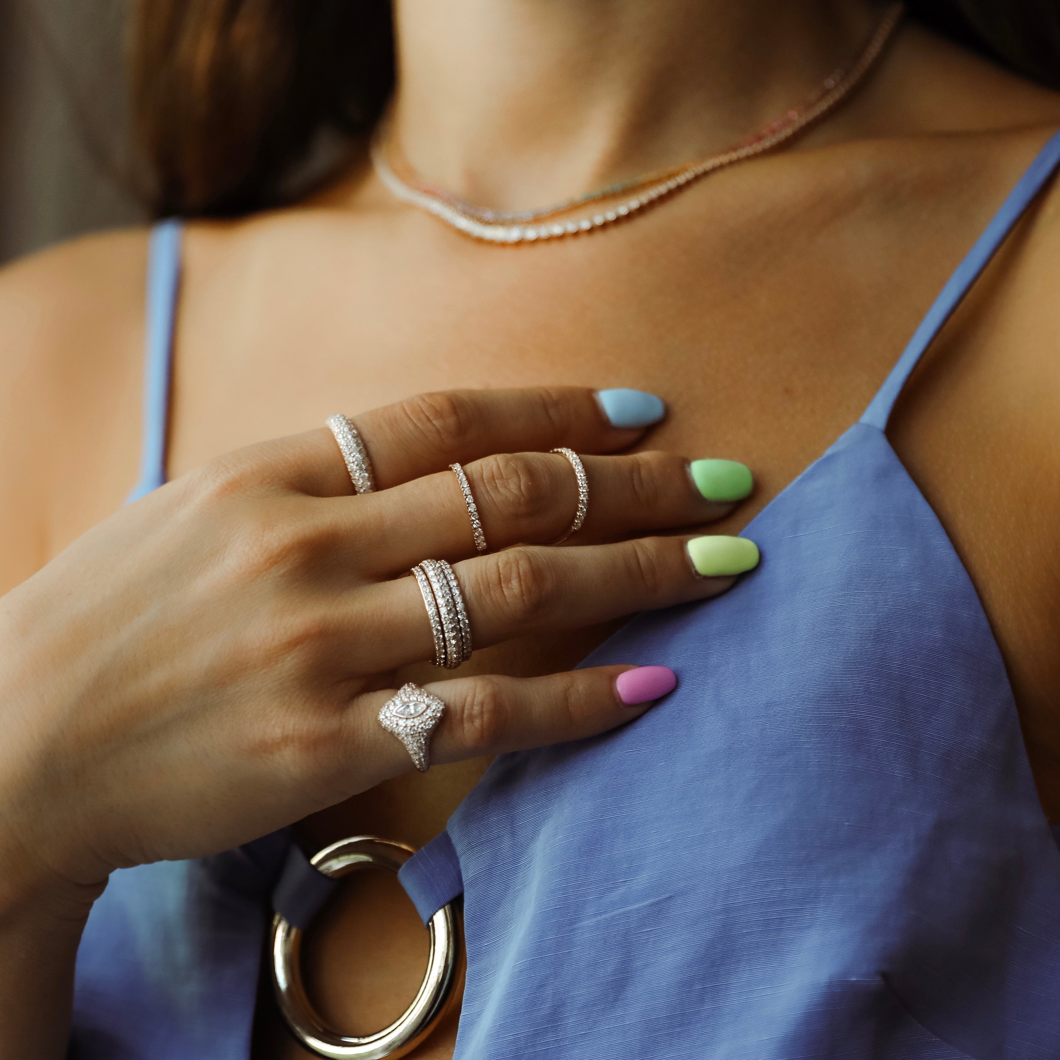 Marquise Bling Pinky Ring shown with the Diamond Orbit Ring, Olympia Ring, and Dome Ring